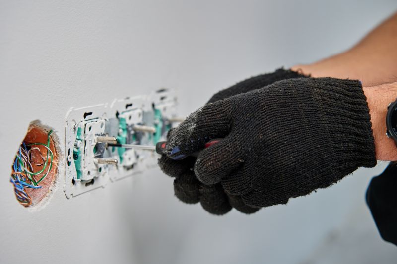Handyman Fixing Electrical Outlet